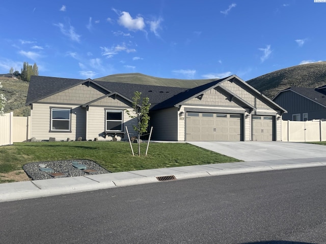 230 Ladera St, Prosser, WA 99350 - ranch-style house with a gate, driveway, an attached garage, a front yard, and fence