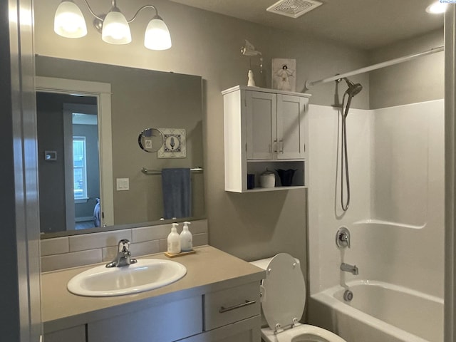 230 Ladera St, Prosser, WA 99350 - full bath with vanity, visible vents, shower / bathing tub combination, and toilet