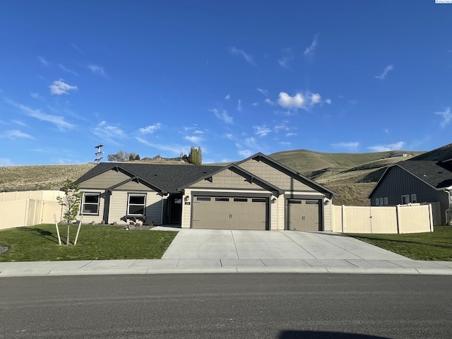 230 Ladera St, Prosser, WA 99350 - single story home featuring a front lawn, fence, a garage, and concrete driveway