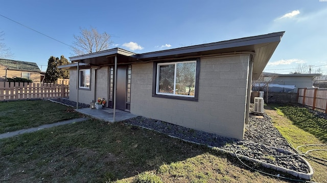 rear view of property featuring a yard