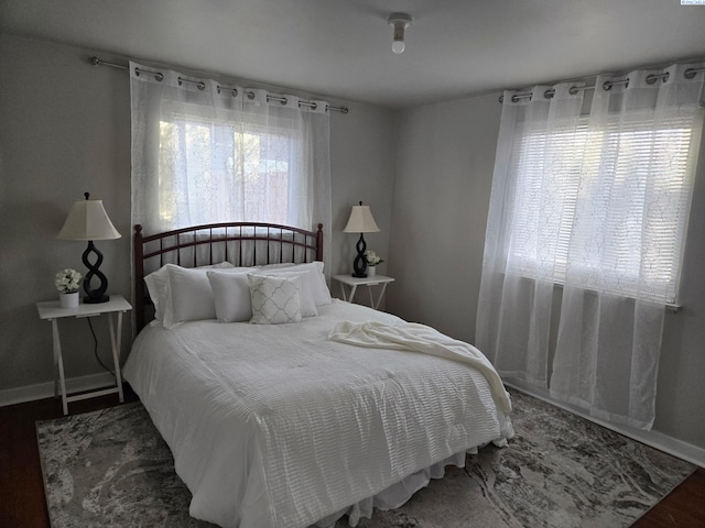 bedroom with hardwood / wood-style flooring