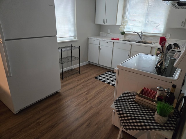 kitchen featuring sink, white cabinetry, ventilation hood, dark hardwood / wood-style flooring, and white fridge