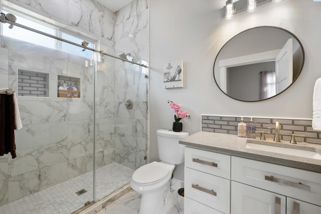 full bath featuring marble finish floor, tasteful backsplash, toilet, a shower stall, and vanity