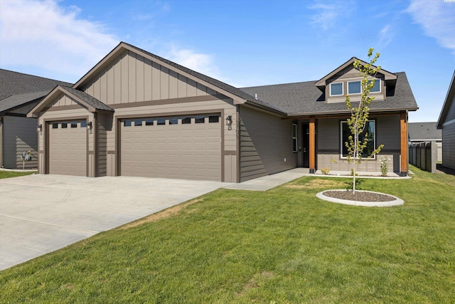 view of front facade featuring a garage and a front lawn