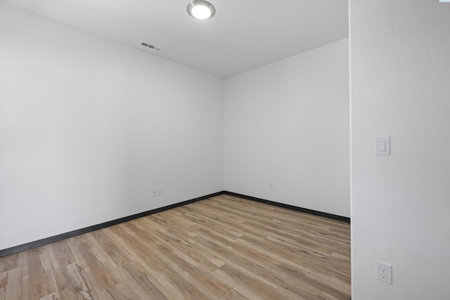 spare room featuring light wood-type flooring