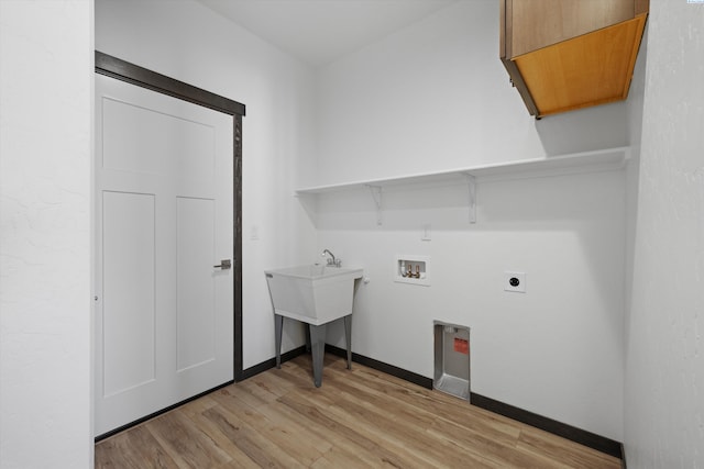 laundry area featuring hookup for a washing machine, electric dryer hookup, and light hardwood / wood-style flooring