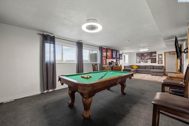 recreation room with pool table, carpet, and a textured ceiling