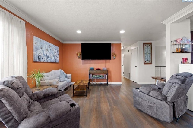 living room with ornamental molding, hardwood / wood-style floors, and a textured ceiling