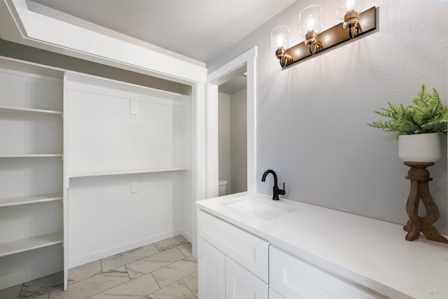 814 Cottonwood Loop, Richland, WA 99354 - bathroom featuring marble finish floors, toilet, and vanity