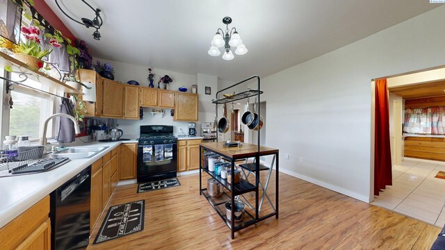 420 E Houghton St, Palouse, WA 99161 - kitchen featuring black appliances, a sink, light countertops, and a chandelier