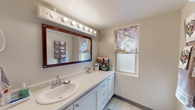 bathroom featuring baseboards, vanity, and tile patterned floors