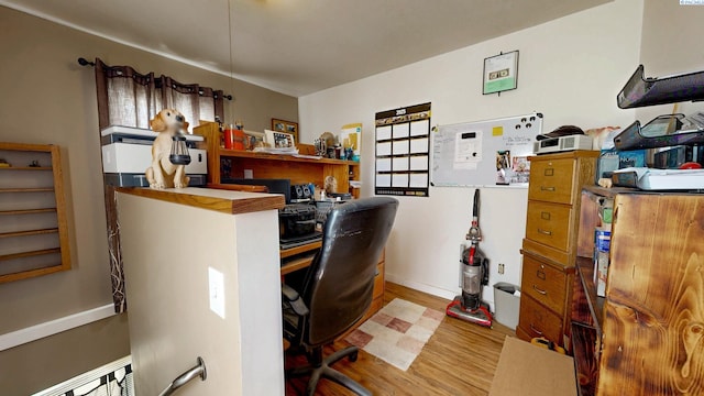 office featuring baseboards and wood finished floors