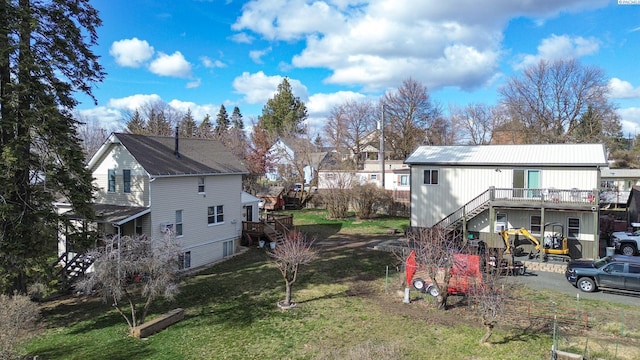 view of yard with a deck and stairs