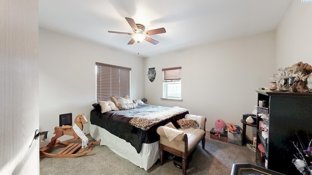 carpeted bedroom with a ceiling fan