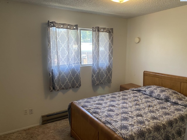 1026 Hemlock St, Prosser, WA 99350 - bedroom with a baseboard heating unit, carpet floors, and a textured ceiling