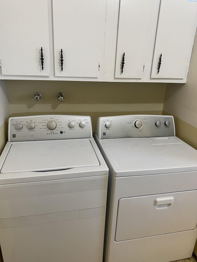 1026 Hemlock St, Prosser, WA 99350 - laundry area featuring separate washer and dryer and cabinet space