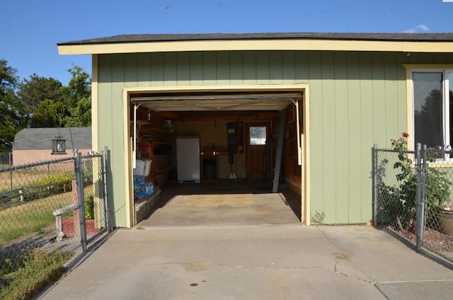 1026 Hemlock St, Prosser, WA 99350 - garage featuring driveway and fridge
