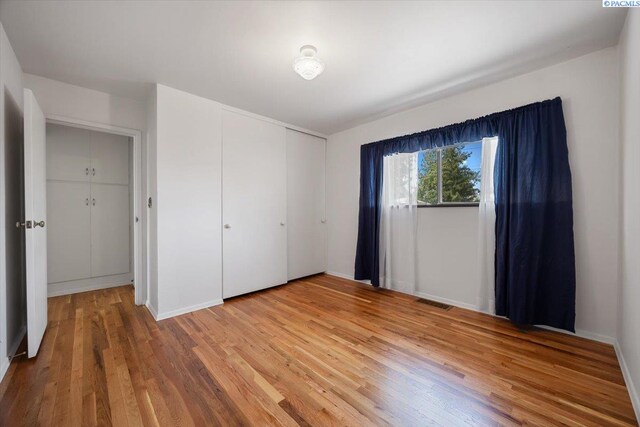 1923 Hood Ave, Richland, WA 99354 - unfurnished bedroom featuring light wood-type flooring and a closet