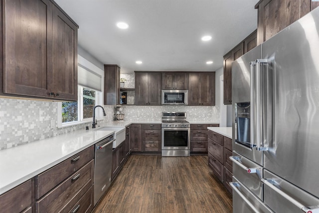 7816 W Argent Rd, Pasco, WA 99301 - kitchen featuring dark wood-type flooring, stainless steel appliances, sink, and dark brown cabinets