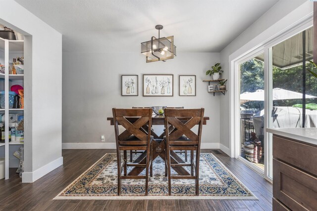 7816 W Argent Rd, Pasco, WA 99301 - dining space with an inviting chandelier and dark hardwood / wood-style floors