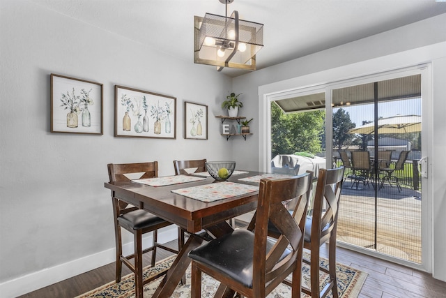 7816 W Argent Rd, Pasco, WA 99301 - dining room featuring an inviting chandelier and dark hardwood / wood-style floors