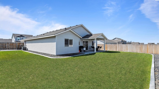 5817 Ramus Ln, Pasco, WA 99301 - rear view of property featuring a fenced backyard, a patio, a yard, and cooling unit