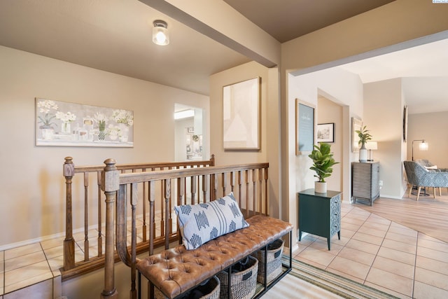sitting room featuring baseboards and light tile patterned floors