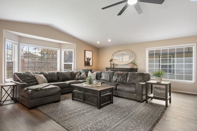 living area with vaulted ceiling, a ceiling fan, wood finished floors, and recessed lighting