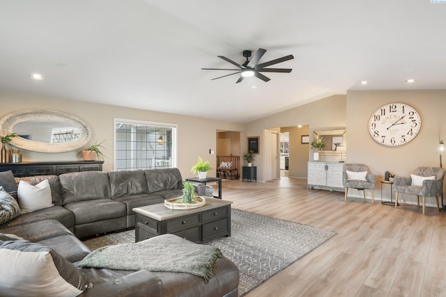 living area featuring lofted ceiling, recessed lighting, light wood-style floors, and ceiling fan
