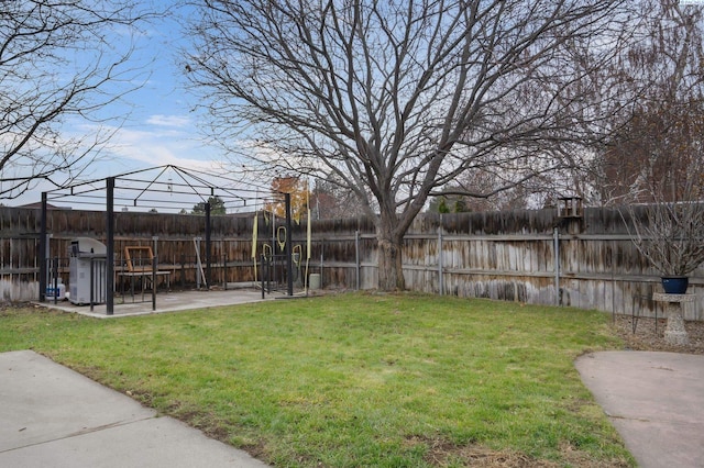 view of yard with a fenced backyard, a gazebo, and a patio