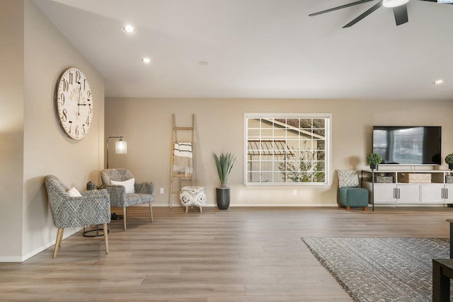 living area featuring baseboards, wood finished floors, recessed lighting, and ceiling fan