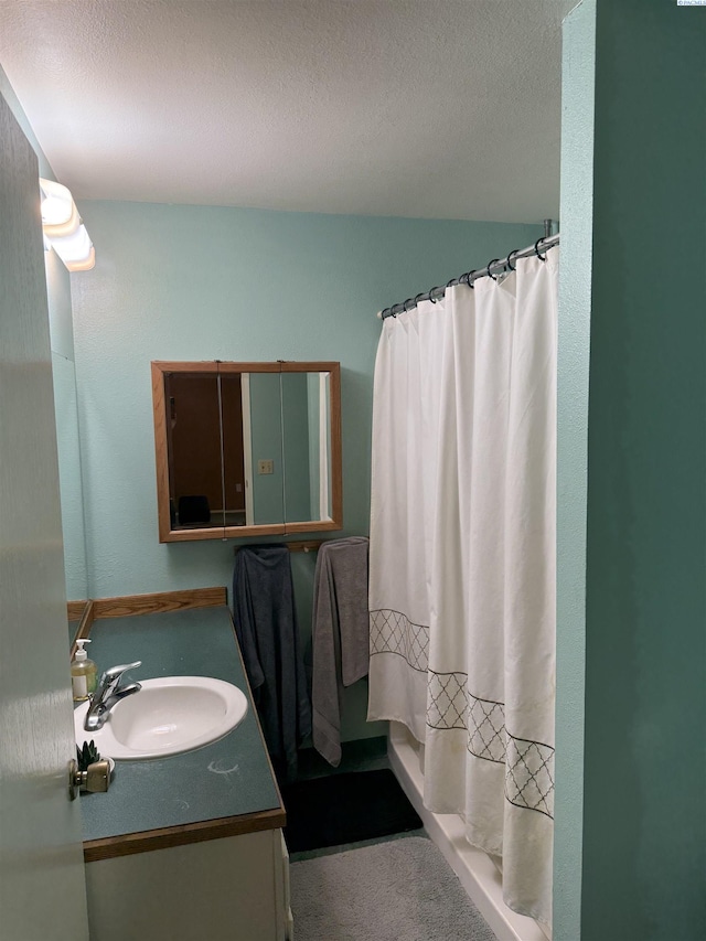 1336 Semillon Pl, Prosser, WA 99350 - bathroom featuring curtained shower, a textured ceiling, and vanity