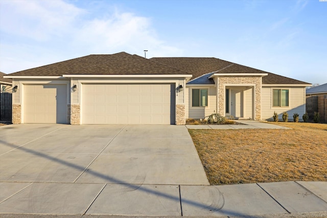 ranch-style house featuring a garage