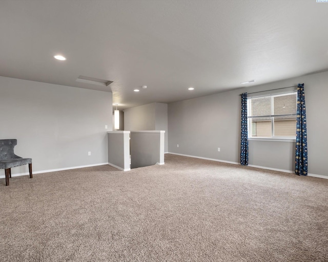 carpeted spare room with recessed lighting and baseboards