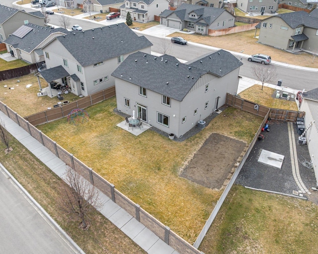 birds eye view of property with a residential view