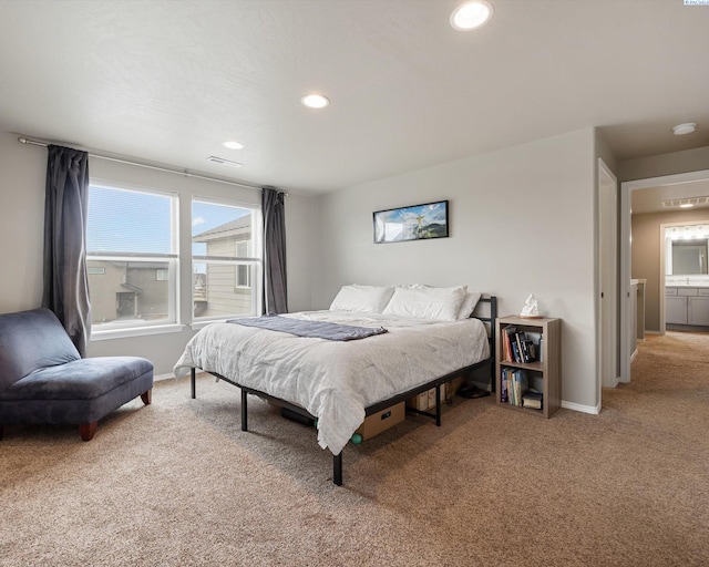 carpeted bedroom with recessed lighting, visible vents, and baseboards