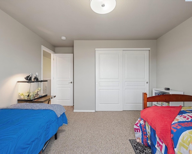 bedroom with a closet and carpet flooring