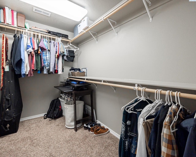 spacious closet with carpet floors and visible vents