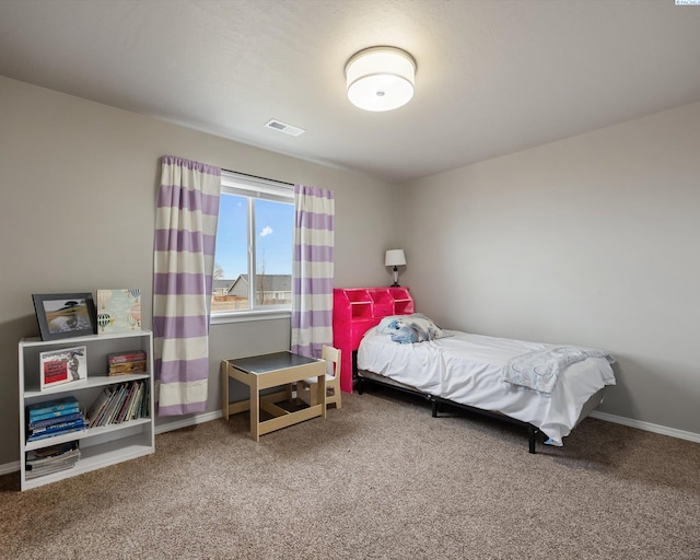 carpeted bedroom with baseboards and visible vents