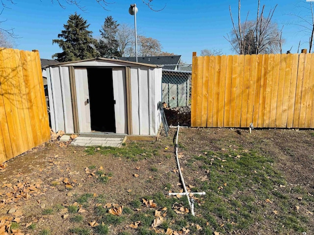 view of shed with a fenced backyard