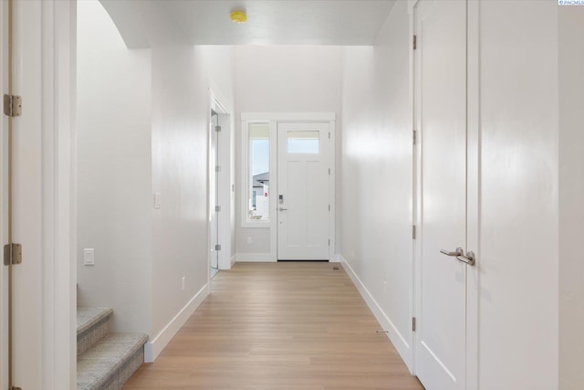 doorway to outside with light hardwood / wood-style flooring