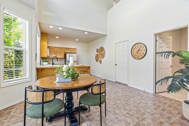 4611 Arabian Ln, Pasco, WA 99301 - dining room featuring a high ceiling, light tile patterned floors, and recessed lighting