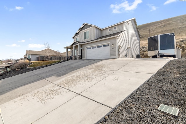 view of property exterior featuring driveway and an attached garage