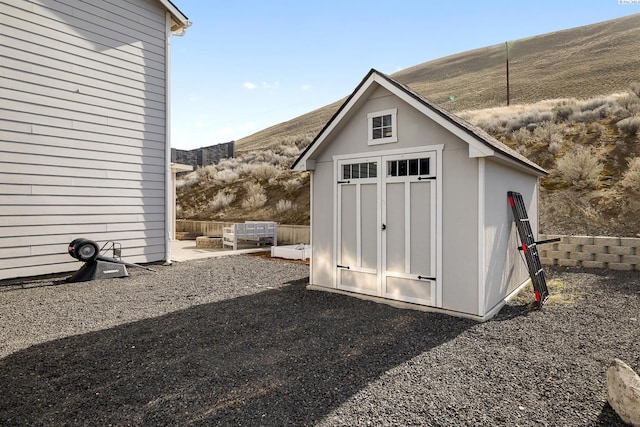 view of shed with a mountain view