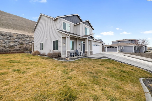 traditional home featuring concrete driveway and a front lawn