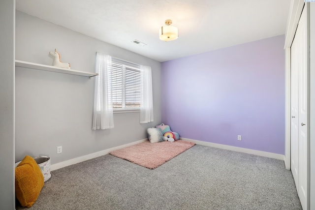 playroom with baseboards, visible vents, and carpet flooring