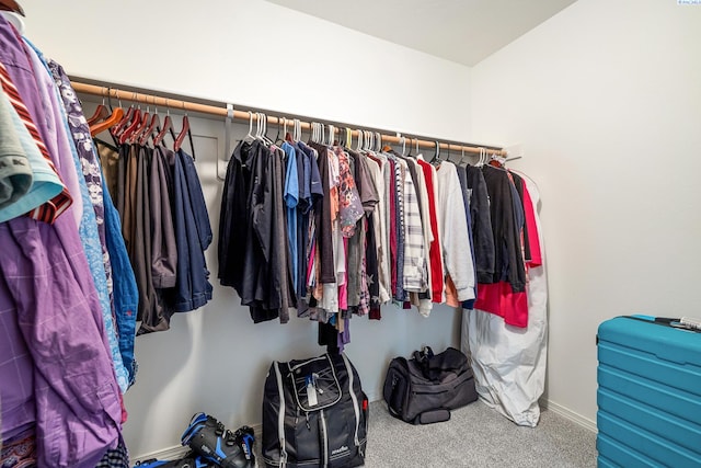 walk in closet featuring carpet