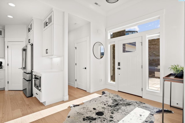 foyer with light hardwood / wood-style flooring