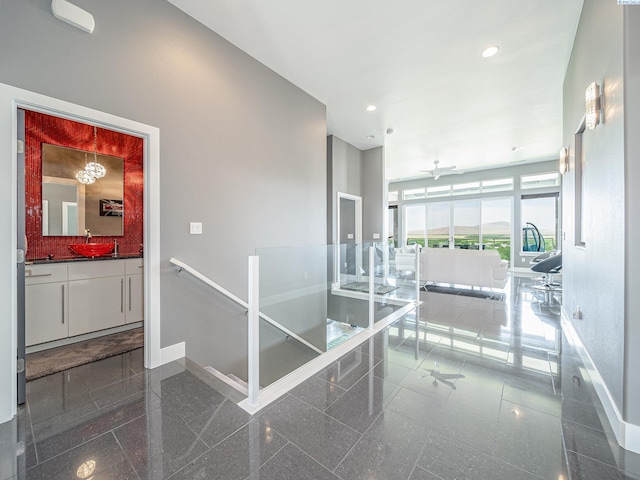 5880 S 58th Ave, West Richland, WA 99353 - corridor with granite tiled floors, recessed lighting, and an upstairs landing