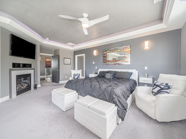 5880 S 58th Ave, West Richland, WA 99353 - carpeted bedroom featuring a raised ceiling, a fireplace, ornamental molding, and a ceiling fan